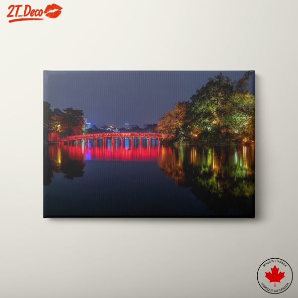 Illuminated Bridge Over Water at Night