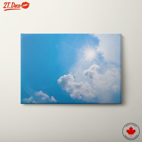 Vibrant Blue Sky with Sunlight and Clouds