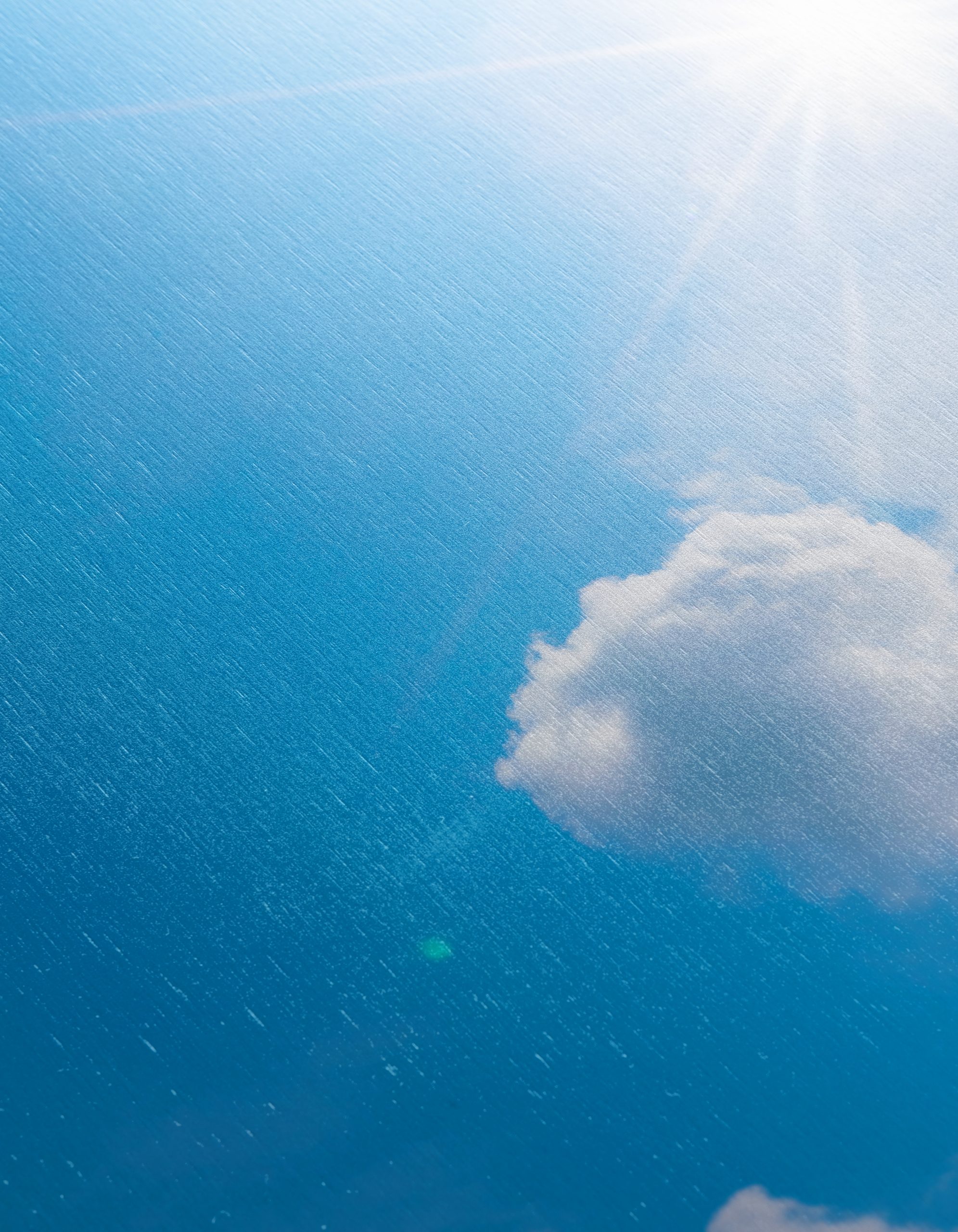 Vibrant Blue Sky with Sunlight and Clouds - Image 12