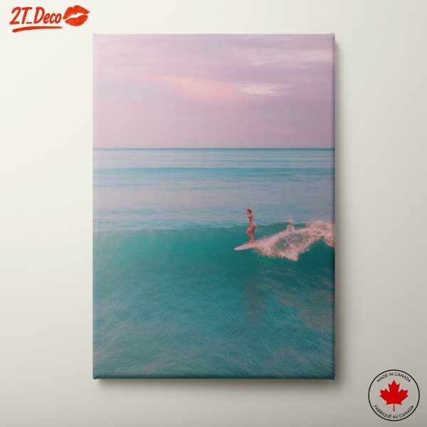 Surfer Riding a Wave at Sunset