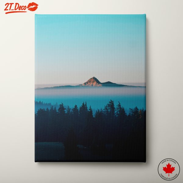 Mountain Peak Surrounded by Misty Forest