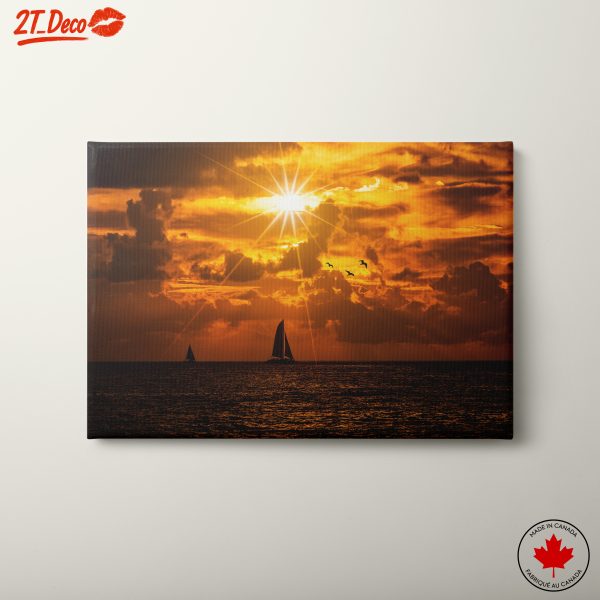 Stunning Sunset Over Beach with Sailboats