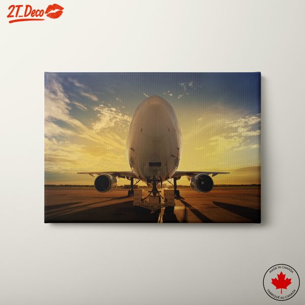 Airplane at Sunset with Dramatic Clouds
